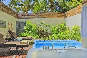 Verdant garden villa with private pool.