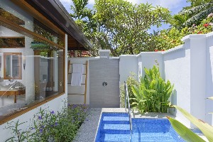 Spacious beachfront villa with sunrise views.