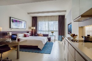 Studio with king bed, kitchenette.