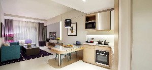 Two-bedroom suite, kitchenette, workspace.