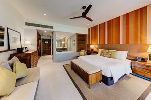 Unwind with a view of gardens & beach.